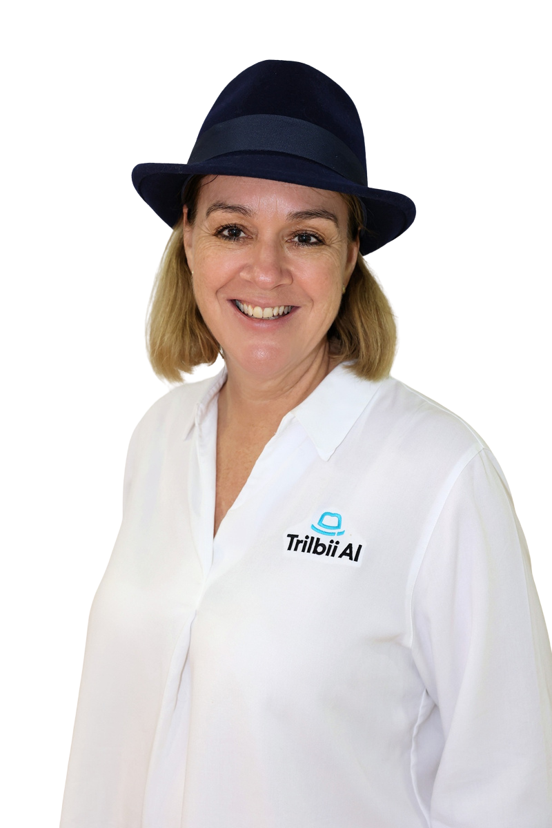 Carolyn S Dean, Founder and CEO of Trilbii AI, wearing a navy trilby hat and a white Trilbii AI shirt