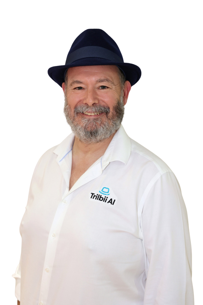 Anthony Middlemiss, Co-Founder and Head of Customer Success at Trilbii AI, wearing a navy trilby hat and a white Trilbii AI shirt